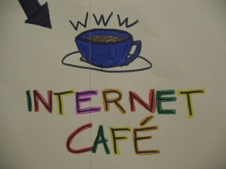 Cup of coffee with www on top for an internet cafe
